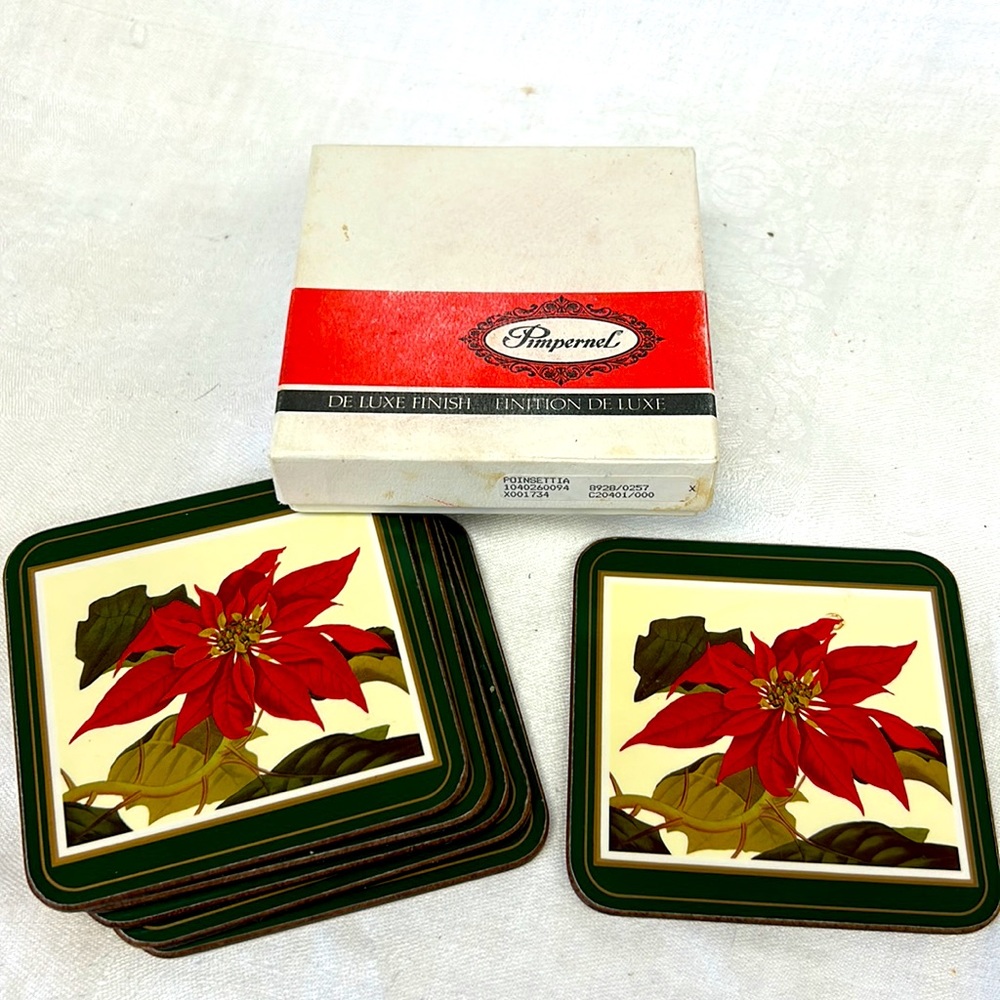 Vintage boxed set of 6 cork backed poinsettia coasters by “Pimpernel” England